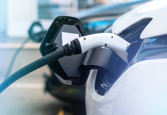 plugged-chargers-into-two-electric-cars-charge-station-(1).png plugged-chargers-into-two-electric-cars-charge-station-(1).png